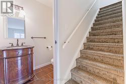 Let's head upstairs past the main level bathroom. - 