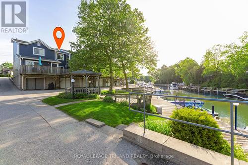 Note how nicely this unit faces the riverfront. - 4 - 5 River Road, Lambton Shores (Grand Bend), ON - Outdoor With Deck Patio Veranda