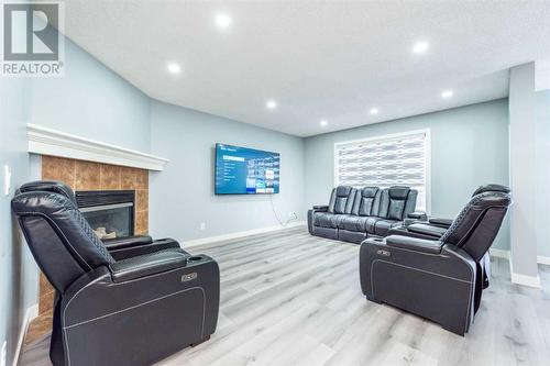 129 Lakeview Inlet, Chestermere, AB - Indoor Photo Showing Living Room With Fireplace