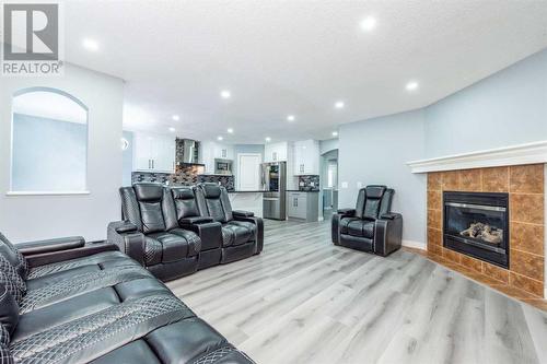 129 Lakeview Inlet, Chestermere, AB - Indoor Photo Showing Living Room With Fireplace