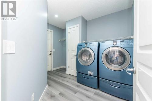 129 Lakeview Inlet, Chestermere, AB - Indoor Photo Showing Laundry Room