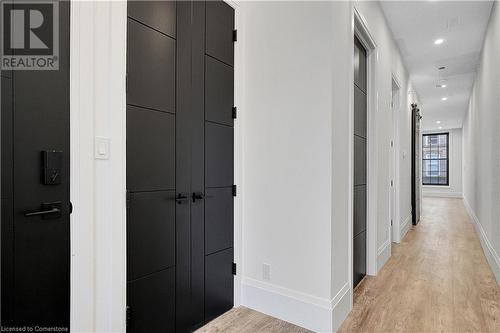 Hallway featuring light wood-type flooring - 29 Main Street Unit# 201, Cambridge, ON - Indoor Photo Showing Other Room