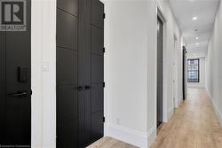 Hallway featuring light wood-type flooring - 