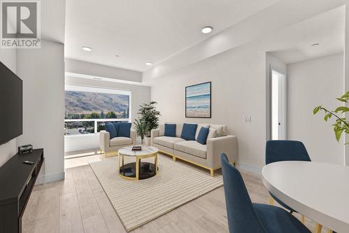 Photo features virtual staging which may not be indicative of actual unit measurements. - 651 Dunes Drive Unit# 306, Kamloops, BC - Indoor Photo Showing Living Room