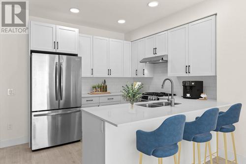 Photo features virtual staging which may not be indicative of actual unit measurements. - 651 Dunes Drive Unit# 306, Kamloops, BC - Indoor Photo Showing Kitchen With Double Sink