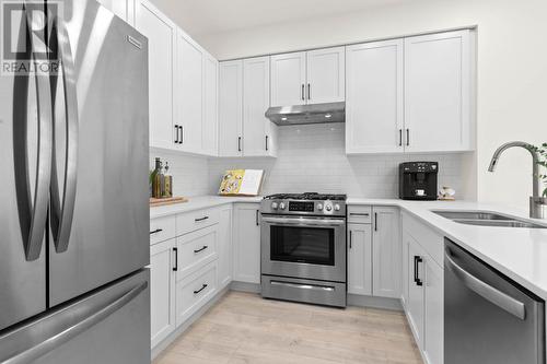 Photo features virtual staging which may not be indicative of actual unit measurements. - 651 Dunes Drive Unit# 306, Kamloops, BC - Indoor Photo Showing Kitchen With Double Sink With Upgraded Kitchen