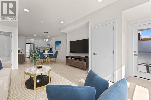 Photo features virtual staging which may not be indicative of actual unit measurements. - 651 Dunes Drive Unit# 306, Kamloops, BC - Indoor Photo Showing Living Room