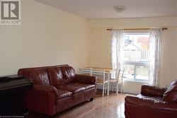 Living room featuring wood-type flooring - 