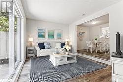 Living room featuring wood-type flooring - 