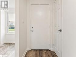 Doorway to outside with hardwood / wood-style floors - 