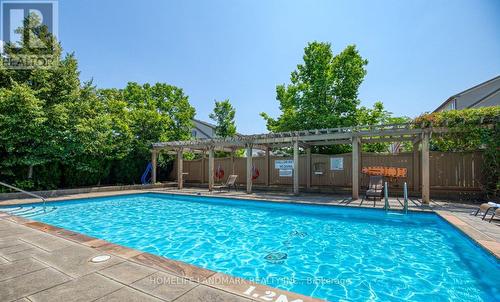 1009 - 2325 Central Park Drive, Oakville, ON - Outdoor With In Ground Pool With Backyard