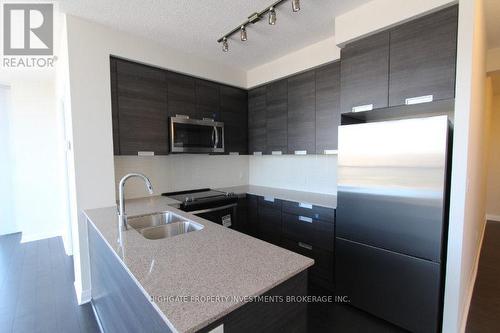 717 - 5033 Four Springs Avenue, Mississauga, ON - Indoor Photo Showing Kitchen With Double Sink With Upgraded Kitchen