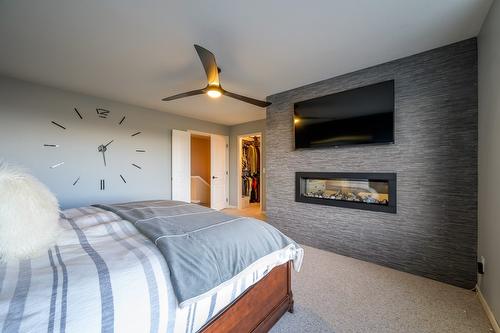 8-2365 Abbeyglen Way, Kamloops, BC - Indoor Photo Showing Bedroom With Fireplace