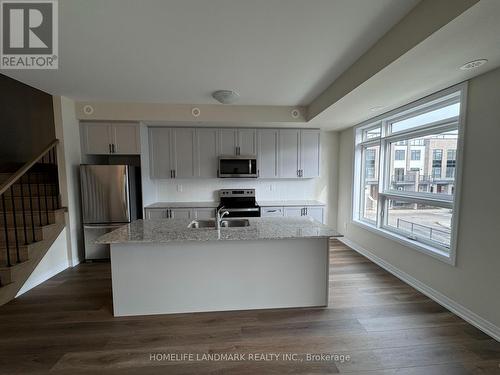 109 - 1593 Rose Way, Milton, ON - Indoor Photo Showing Kitchen With Stainless Steel Kitchen With Double Sink