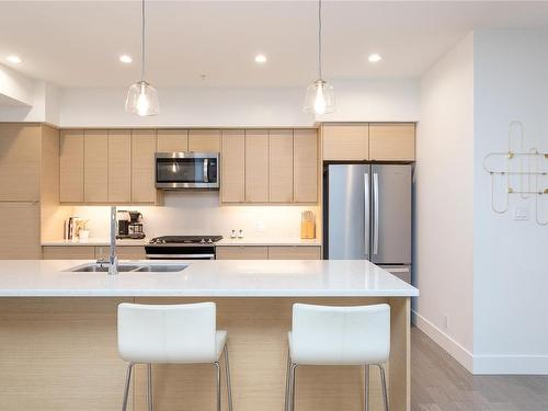 205-10670 Mcdonald Park Rd, North Saanich, BC - Indoor Photo Showing Kitchen With Stainless Steel Kitchen With Double Sink With Upgraded Kitchen