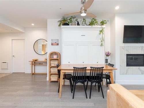 205-10670 Mcdonald Park Rd, North Saanich, BC - Indoor Photo Showing Dining Room With Fireplace