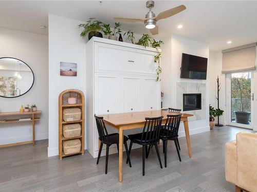 205-10670 Mcdonald Park Rd, North Saanich, BC - Indoor Photo Showing Dining Room With Fireplace