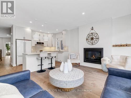 565 Bobolink Ridge, Ottawa, ON - Indoor Photo Showing Living Room With Fireplace