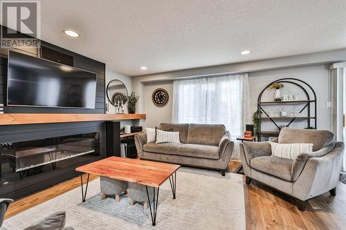 19 Tisdale Court, Kitchener, ON - Indoor Photo Showing Living Room With Fireplace