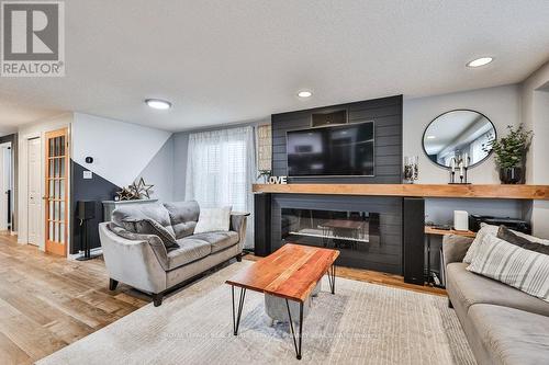 19 Tisdale Court, Kitchener, ON - Indoor Photo Showing Living Room With Fireplace