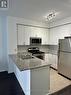 310 - 225 Webb Drive, Mississauga, ON  - Indoor Photo Showing Kitchen With Stainless Steel Kitchen With Double Sink 