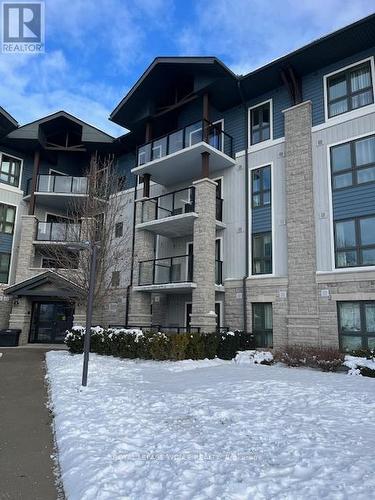 411 - 50 Bryan Court, Kitchener, ON - Outdoor With Balcony With Facade