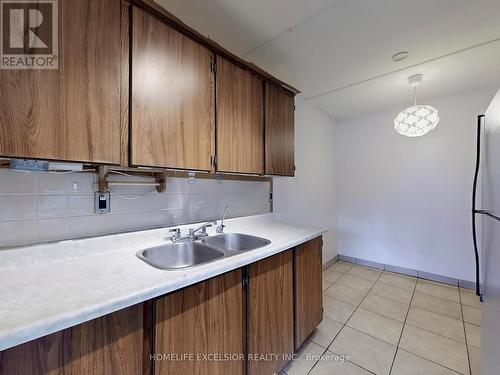 202 - 2 Glamorgan Avenue, Toronto, ON - Indoor Photo Showing Kitchen With Double Sink