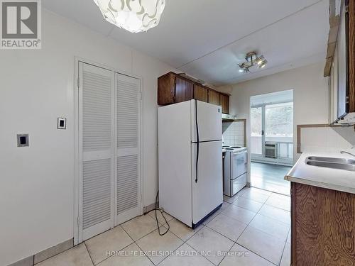 202 - 2 Glamorgan Avenue, Toronto, ON - Indoor Photo Showing Kitchen With Double Sink