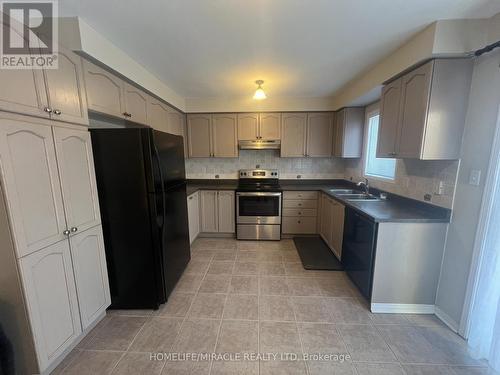 Upper - 32 Earlsbridge Boulevard, Brampton, ON - Indoor Photo Showing Kitchen With Stainless Steel Kitchen With Double Sink