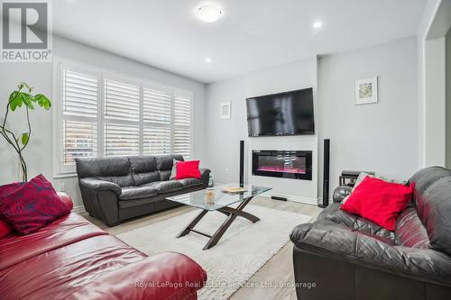 688 Kennedy Circle W, Milton (1026 - Cb Cobban), ON - Indoor Photo Showing Living Room With Fireplace