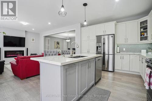 688 Kennedy Circle W, Milton (1026 - Cb Cobban), ON - Indoor Photo Showing Kitchen With Fireplace With Double Sink With Upgraded Kitchen