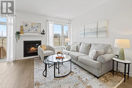 81 Canvasback Ridge, Ottawa, ON - Indoor Photo Showing Living Room With Fireplace