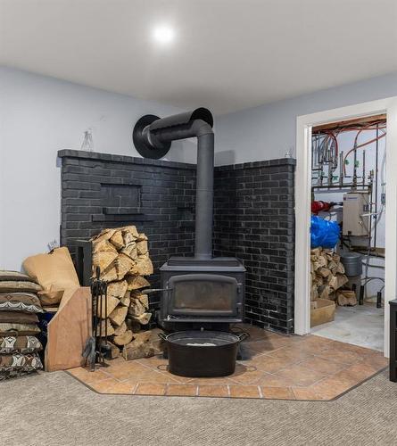 25 Queen Street, Springstein, MB - Indoor With Fireplace