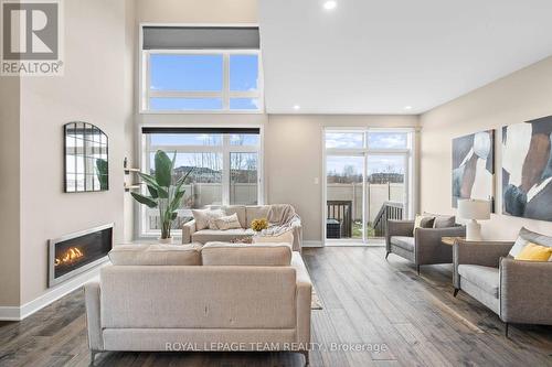 210 Taurus Place, Ottawa, ON - Indoor Photo Showing Living Room With Fireplace