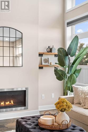 210 Taurus Place, Ottawa, ON - Indoor Photo Showing Living Room With Fireplace