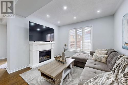 38 Eastport Drive, Toronto, ON - Indoor Photo Showing Living Room With Fireplace