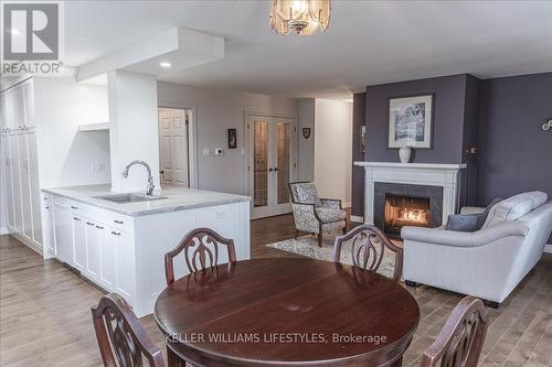 211 - 300 Everglade Crescent, London, ON - Indoor Photo Showing Dining Room With Fireplace