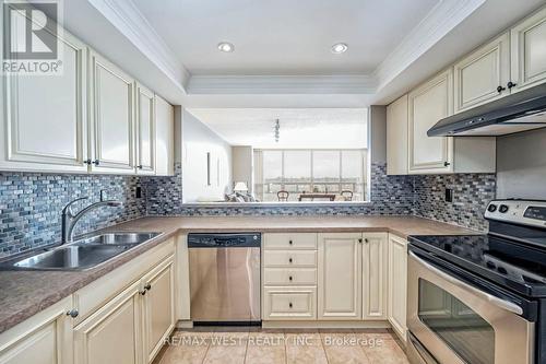 606 - 320 Mill Street S, Brampton, ON - Indoor Photo Showing Kitchen With Double Sink