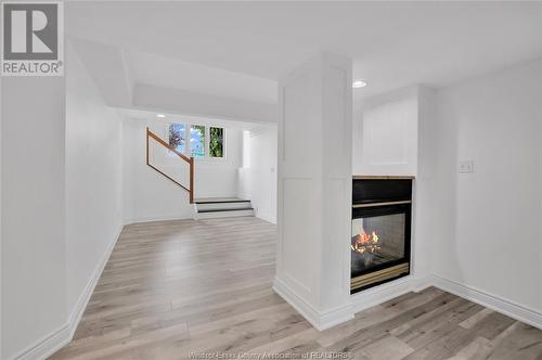 1116 Monarch Meadows Drive, Lakeshore, ON - Indoor Photo Showing Other Room With Fireplace