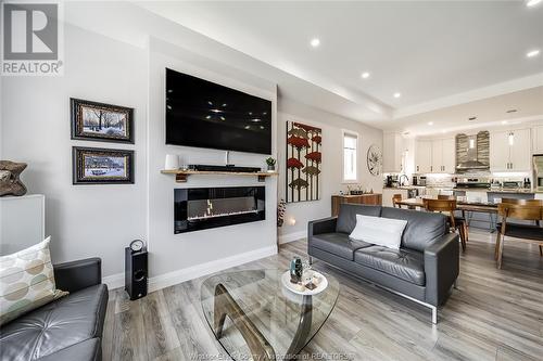 241 Sandybrook, Kingsville, ON - Indoor Photo Showing Living Room With Fireplace