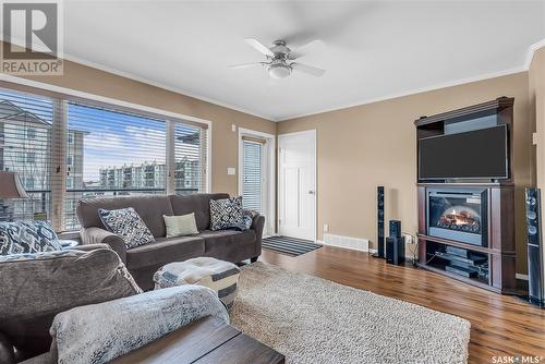 306 110 Shillington Crescent, Saskatoon, SK - Indoor Photo Showing Living Room With Fireplace