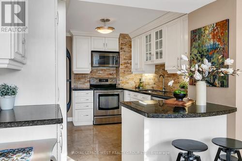 402 - 1 Aberfoyle Crescent Street, Toronto, ON - Indoor Photo Showing Kitchen With Upgraded Kitchen