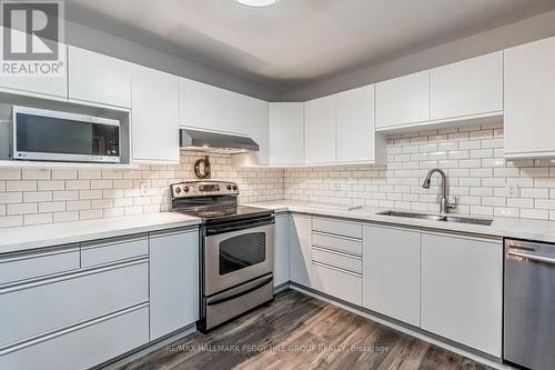 303 - 131 Clapperton Street, Barrie, ON - Indoor Photo Showing Kitchen With Stainless Steel Kitchen With Double Sink With Upgraded Kitchen