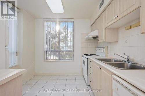 305 - 5039 Finch Avenue E, Toronto, ON - Indoor Photo Showing Kitchen With Double Sink