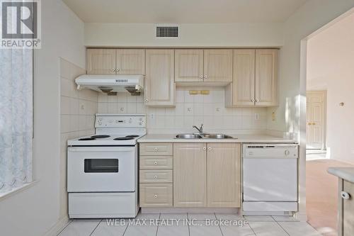 305 - 5039 Finch Avenue E, Toronto, ON - Indoor Photo Showing Kitchen With Double Sink