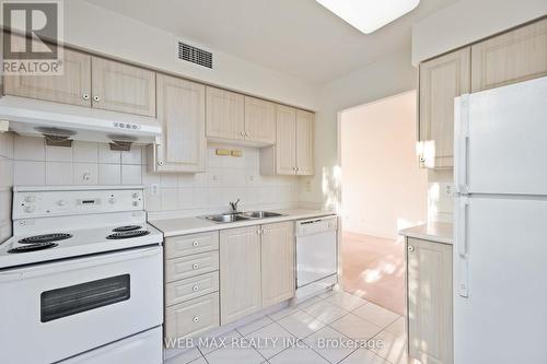 305 - 5039 Finch Avenue E, Toronto, ON - Indoor Photo Showing Kitchen With Double Sink