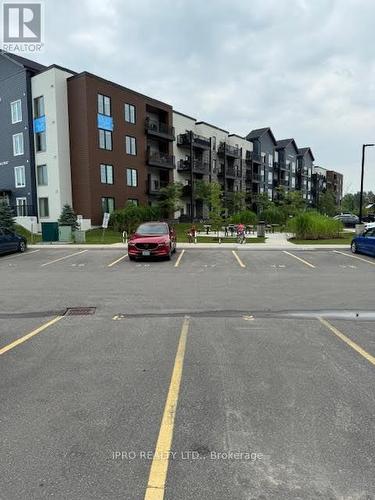 101 - 20 Koda Street, Barrie, ON - Outdoor With Balcony With Facade