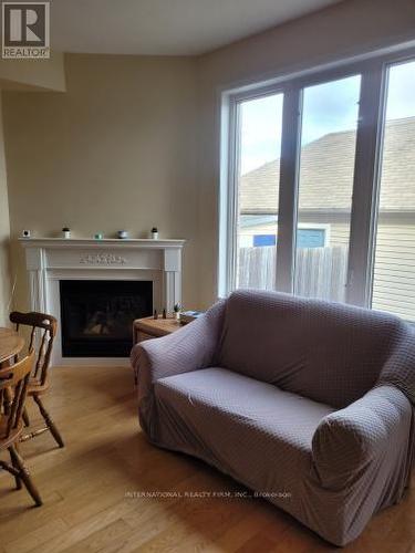 23 Hackett Avenue, Toronto, ON - Indoor Photo Showing Living Room With Fireplace