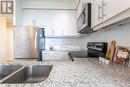 1407 - 3975 Grand Park Drive, Mississauga, ON  - Indoor Photo Showing Kitchen With Stainless Steel Kitchen With Double Sink 