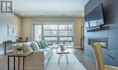 100 - 1705 Fiddlehead Place, London, ON - Indoor Photo Showing Living Room With Fireplace